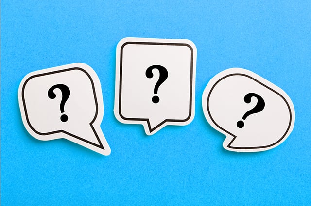 Three white speech bubble cutouts with black question marks inside, arranged side by side on a bright blue background. Each bubble has a different shape. Three white speech bubble cutouts with black question marks inside, arranged side by side on a bright blue background. Each bubble has a different shape.