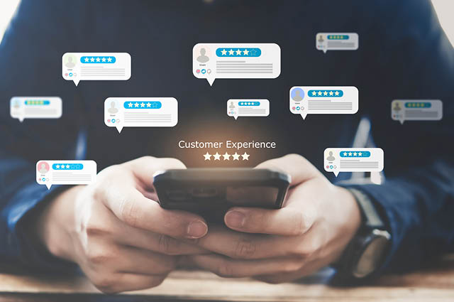 A person uses a smartphone with floating review and rating icons around them, symbolizing online feedback and customer experience. Text in the center reads Customer Experience with five stars below it. A person uses a smartphone with floating review and rating icons around them, symbolizing online feedback and customer experience. Text in the center reads Customer Experience with five stars below it.