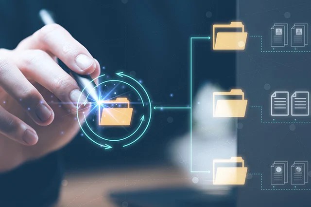 A hand holds a stylus, interacting with a digital interface displaying folder icons connected by lines, representing data organization, storage, or digital file management. A hand holds a stylus, interacting with a digital interface displaying folder icons connected by lines, representing data organization, storage, or digital file management.