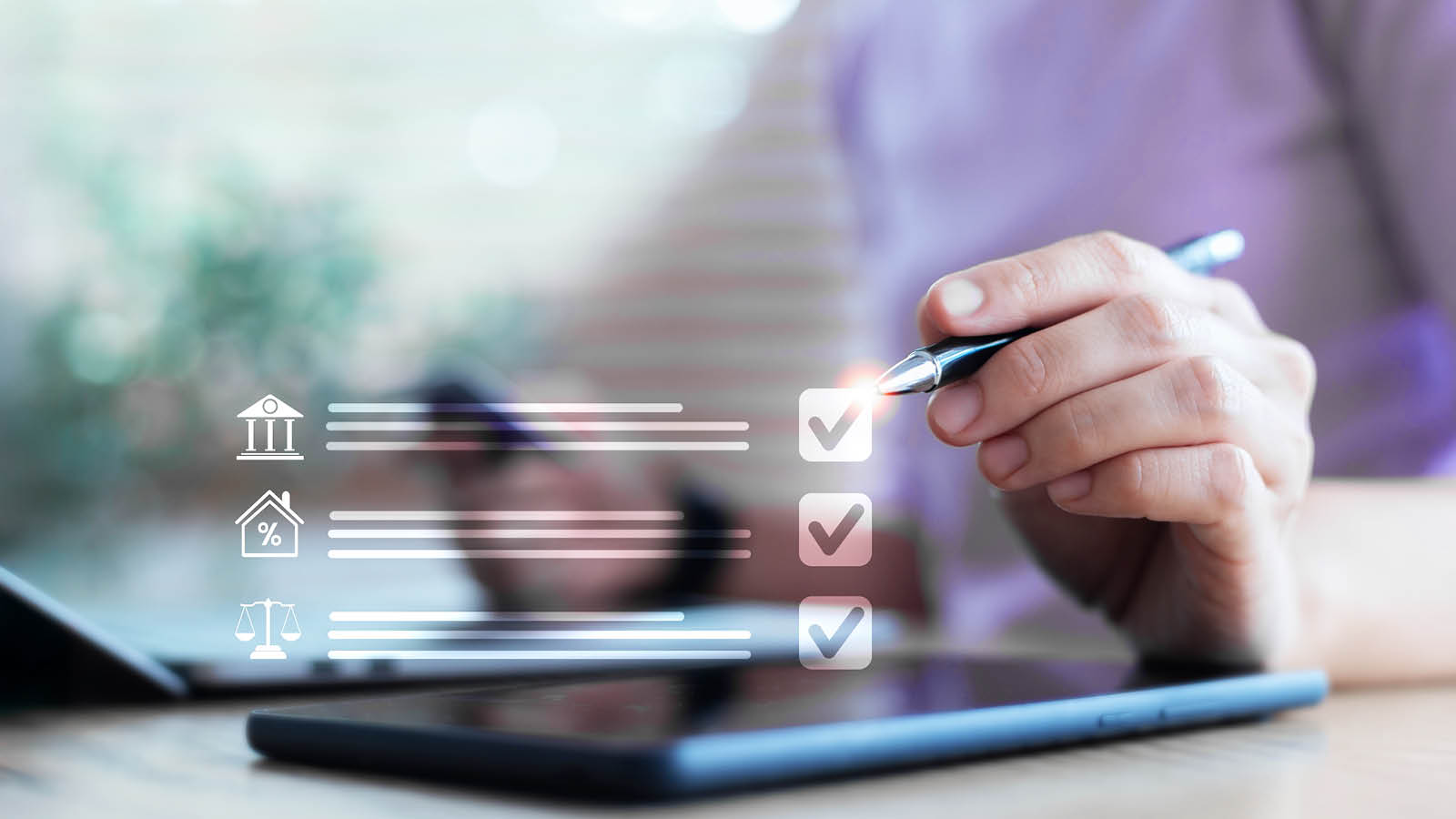 Person reviewing a digital loan application checklist on a tablet, marking completed verification items with a stylus.